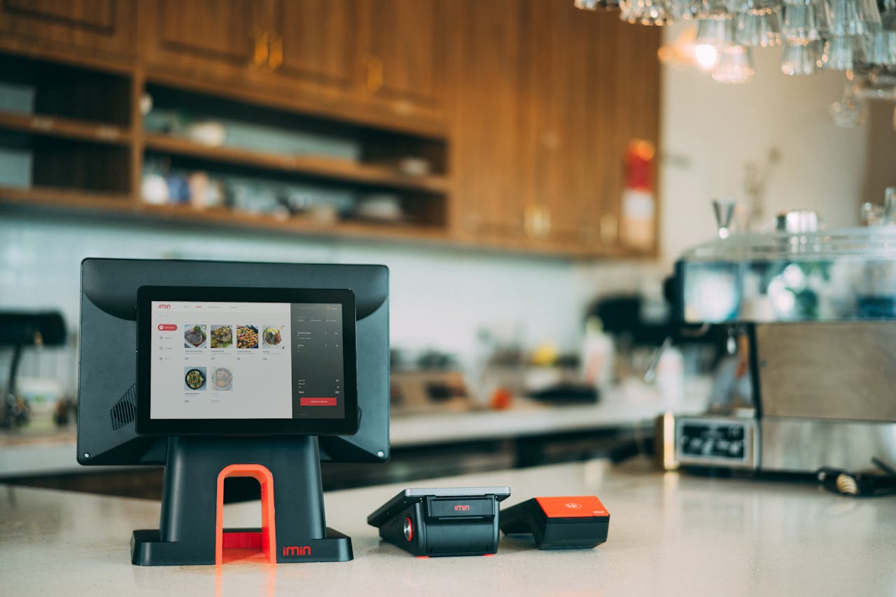 digital A sleek digital point-of-sale system in a contemporary restaurant setting, showcasing cashless payment technology.